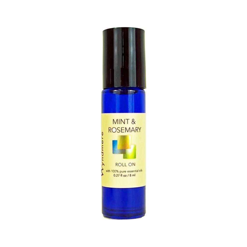 An 8ml cobalt blue roll-on bottle of Wyndmere Mint & Rosemary blend