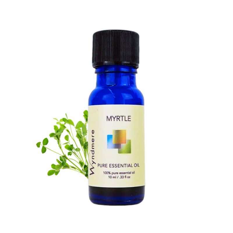 Myrtle leaves with a 10ml cobalt blue bottle of Wyndmere Myrtle Essential Oil