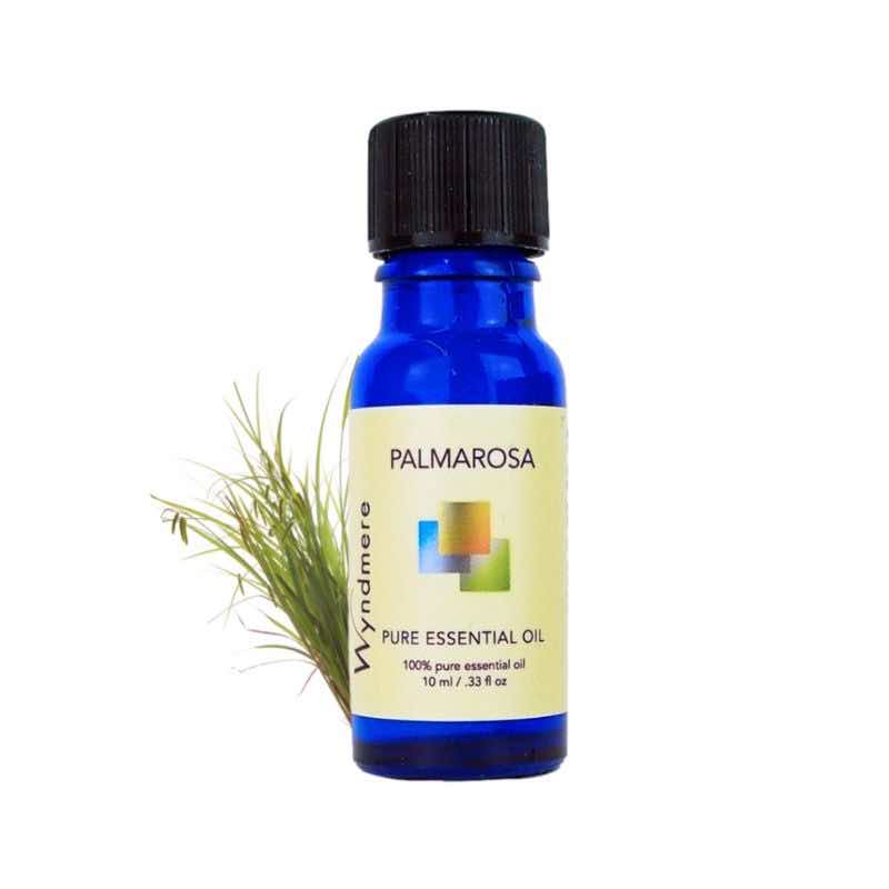 Palmarosa grass with a 10ml cobalt blue bottle of Wyndmere Palmarosa Essential Oil
