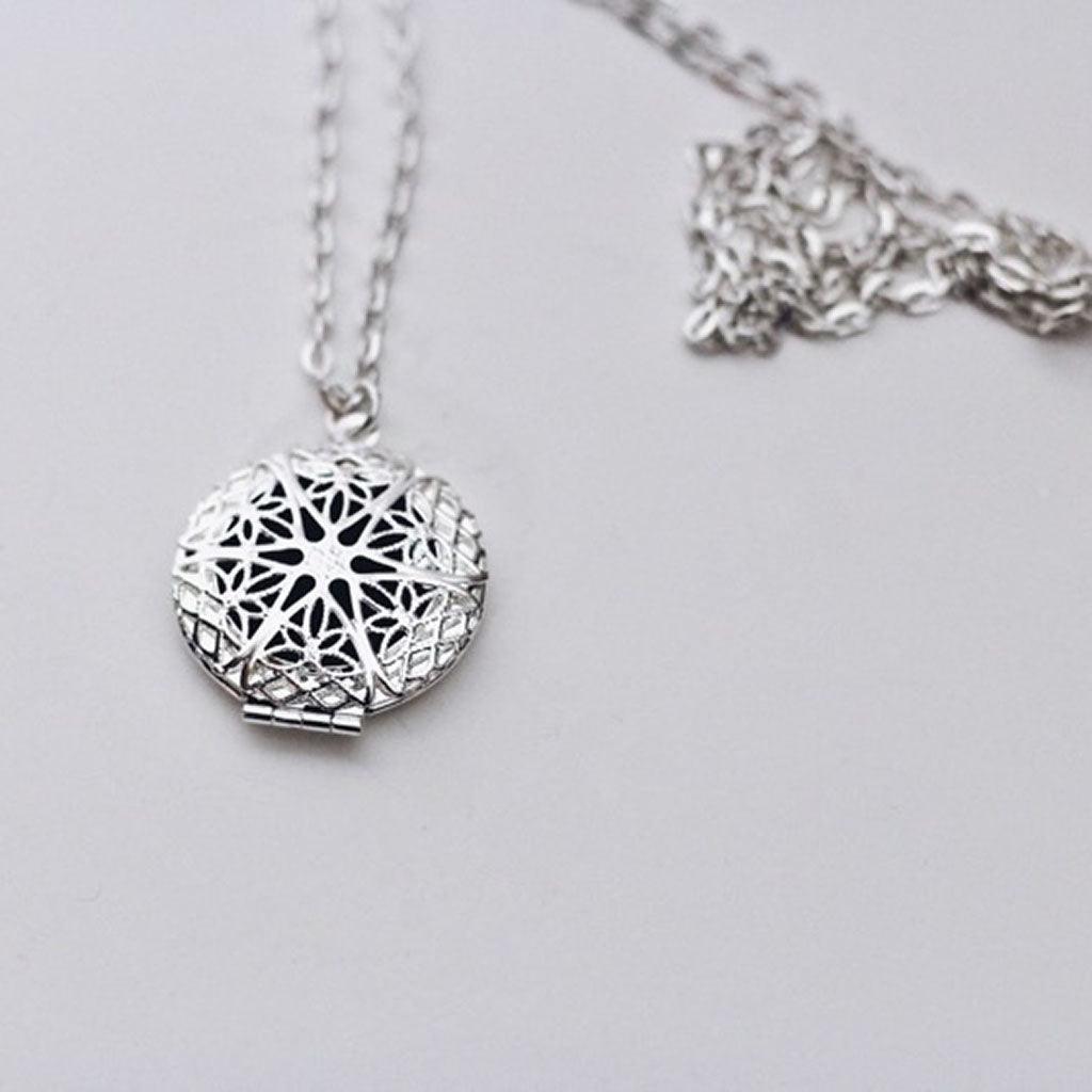 aromatherapy necklace with silver pendant on a silver chain