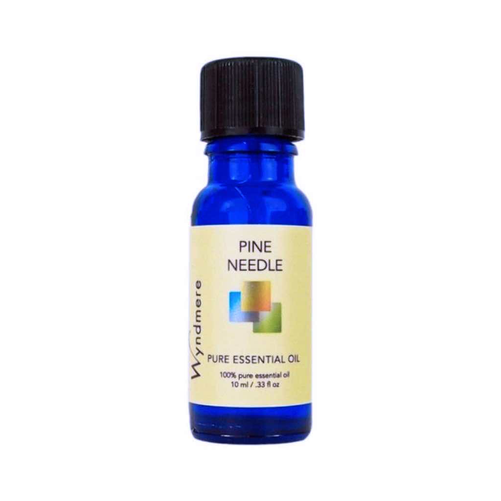 Pine Needle - 10ml cobalt blue bottle of Wyndmere Pine Needle Essential Oil that has a woody, clean forest aroma