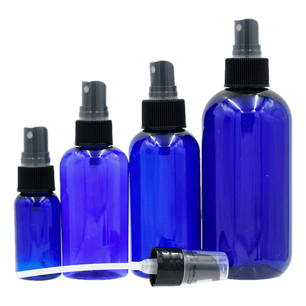Grouping of plastic (PET) bottles of various sizes, shapes - with black fine mist sprayer and clear domed hood