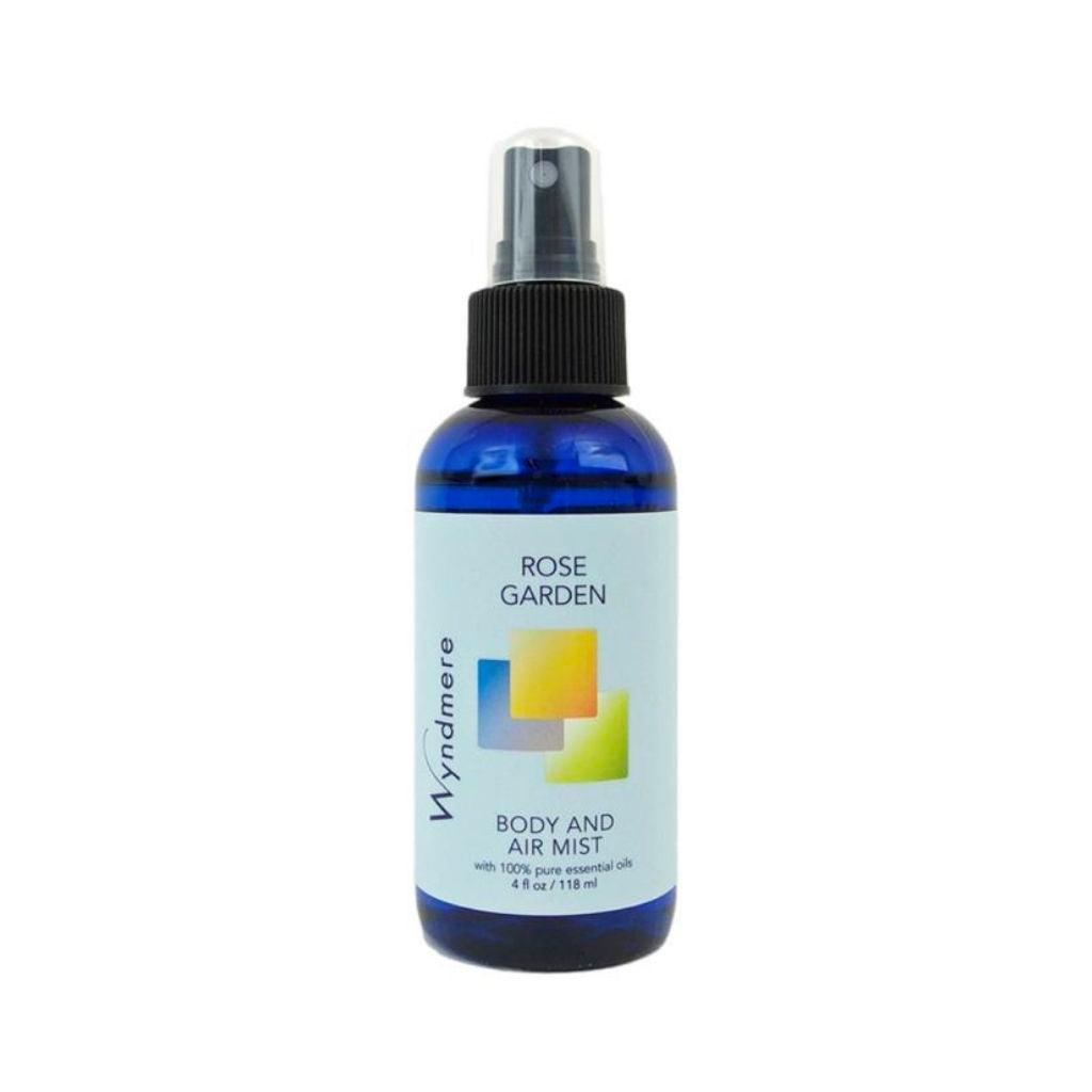Elegantly fragrant essential oil blend of Rose Garden Body & Air Mist in a 4oz blue bottle