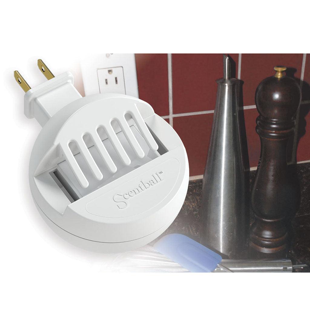 White ScentBall by outlet on kitchen counter with kitchen utensils.