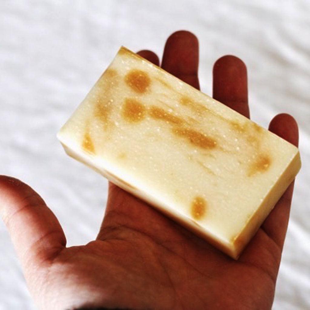 Male hand holding bar of Stress Relief soap