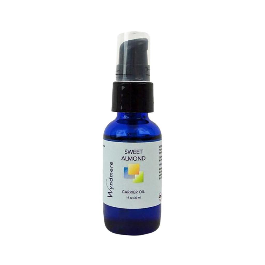 1oz cobalt blue bottle of Wyndmere Sweet Almond Oil with treatment pump