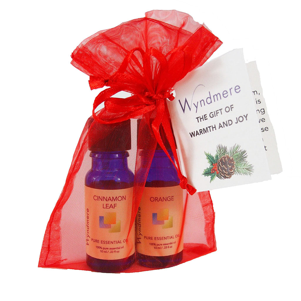 Cinnamon and Orange essential oil in a red organza gift bag for holiday gift giving