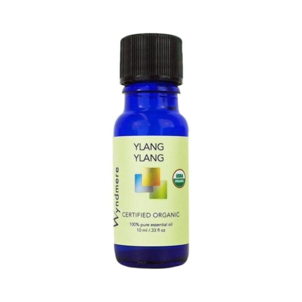 Ylang Ylang - 10ml cobalt blue bottle of Wyndmere Certified Organic Ylang Ylang Essential Oil that has an intensely sweet, floral aroma